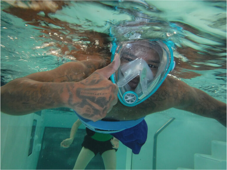 Photo of Z McKinney in the pool at Baylor Scott & White Institute for Rehabilitation. 