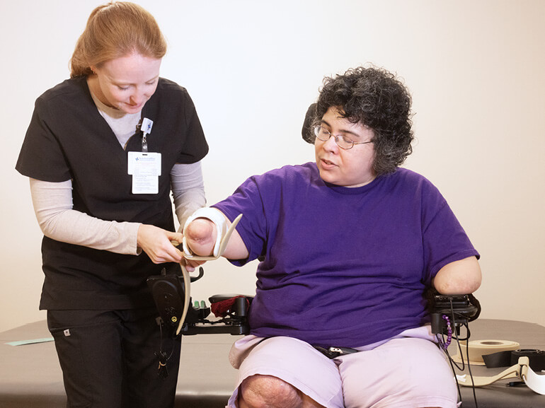 Photo of Francis Zalace with her therapist at Baylor Scott & White Institute for Rehabilitation - Dallas. 