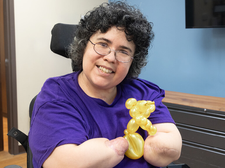 Photo of Francis Zalace showing her balloon art at Baylor Scott & White Institute for Rehabilitation - Dallas. 