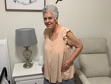Yolanda Murillo smiling for a picture after her recovery at home.