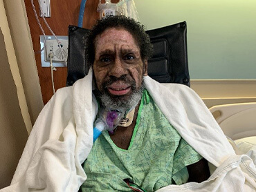 Wilbert Jones smiling for a photo in the hospital during his recovery.