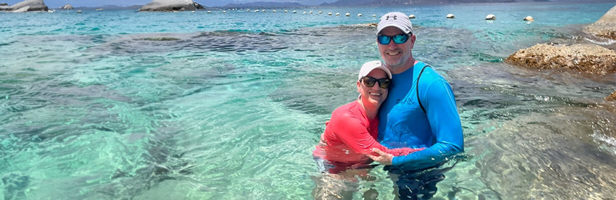 Patient swims in water with husband following care at a Select Medical facility.