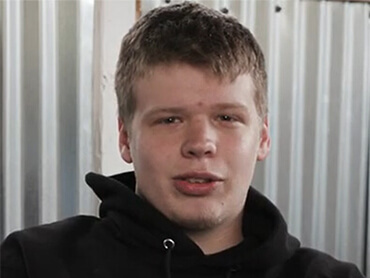 A photo of Tanner smiling during his patient story filming series. 