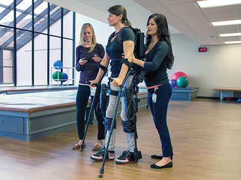 Patient uses advanced technology to walk following a spinal cord injury.