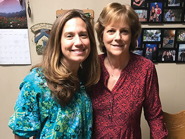 Linda poses with her daughter one year after her cardiac surgery.