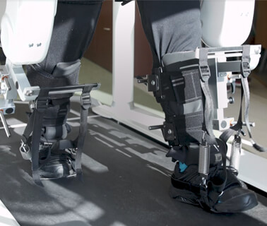 A patient walking with robotic technology to improve their walking capability. 