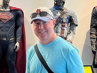 Stephen Allbright smiles in a museum after recovering from a stroke.