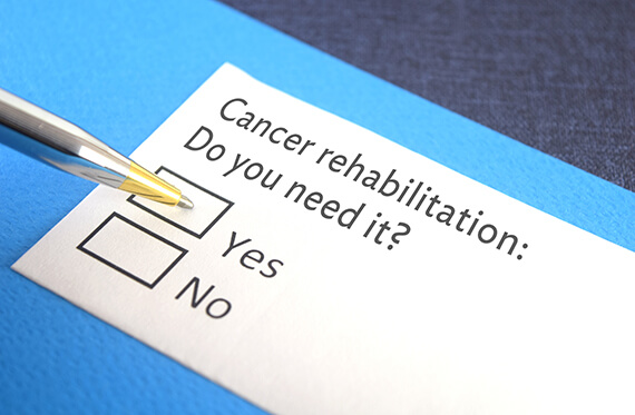 A graphic of a pen and paper that says "Cancer rehabilitation: Do you need it? Yes or no"